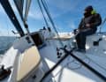 The tiller provides a direct feel for the boat. The helmsman sits high up on board, relaxed for longer. However, the genoa winches on the roof remain out of his reach.