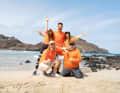 The "Internet King" and his followers: Knossi (below left) with one of the two crews he sent across the Atlantic.