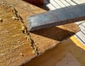 Once the adhesive has dissolved, scrape off the coarse residue with a chisel. Cover the work area, the adhesive residue is very stubborn and difficult to remove.
