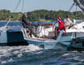 the stern view clearly shows how the hull width increases above the waterline to create more living space.