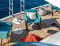 Komfort im Beachclub: Stuhl „Salina“ von  Paola Lenti mit doppelter Stoffbespannung und innenliegender Wattierung.