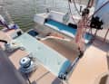 The wide bridge deck takes up space in the cockpit, but creates some below deck.