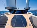 There are no side running decks because the hulls for the wings obstruct the passage to the front. If you want to access the foredeck, you have to go through the saloon.