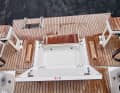 A compartment for the life raft is provided at the stern.