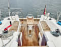 Bavaria C38: The sheet winches are mounted far forward on the coaming. The helmsman has difficulty reaching them from his position.