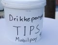 The tips for the seated athletes are collected in the bucket.