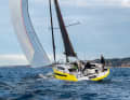 The multi-buckling frame design is particularly evident at the wide stern.