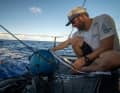 Robert Stanjek launches the measuring buoy into the water