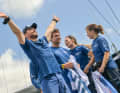 After crossing the finish line, skipper Kevin Escoffier jumped on the cockpit roof and left his arms outstretched at the dock