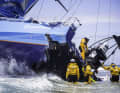 L'equipaggio recupera l'attrezzatura sopra lo sternografo distrutto: Brian Carlin/Team Vestas Wind/Volvo Ocean Race