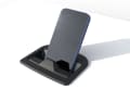 The smartphone sits securely in a recess and is held in place by a latch and magnet. Charging takes place wirelessly via induction.