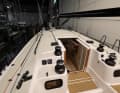 Halyards, sheets and trim lines are operated at the front of the companionway. Only the mainsheet runs aft
