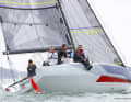 Two rudder blades are attached to the stern. The boat is steered using the tiller