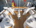 The cockpit has a divided working area with a central winch for the mainsheet, double rudder system and numerous deflected halyards and sheets.