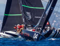 Tony Langley's "Gladiator" had a strong day in light winds.