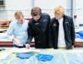 Here, the three companions are immersed in their plans.
