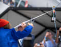 The godmother Dr Sylvia Earle cuts the ribbon with the champagne bottle.