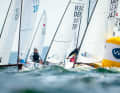 71 OK dinghies formed an impressive picture at the start on the Medienbahn Hotel directly in front of the backdrop of Kiel-Schilksee