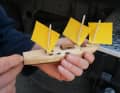 Yrvind shows the model of a rig for his sailing canoe.