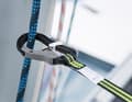Is the clamp really closed? In general, the running rigging should not be used to pick the lifeline