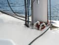 The halyards run from the mast through a false floor under the deckhouse