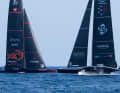 The American "Patriot" on the foils, Alinghi Red Bull Racing's "BoatOne" has fallen off the foils