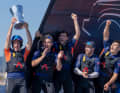 From America's Cup novice to Louis Vuitton Cup winner: Olympic 49er champion and Moth World Champion Dylan Fletcher with the trophy and his jubilant crew