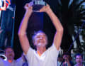 Sir Jim Ratcliffe lifts the Louis Vuitton Cup into the sky above Barcelona.