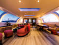 Sweeping lines: Designer Rick Baker realised a curvaceous interior. The curved glazing on the main deck is one of the technical highlights.