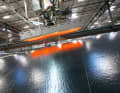 Bonding: The adhesive is activated by heat. A vacuum compresses the membrane