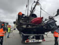 The helpers secure the "ghost ship" called "Wibo"