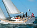The deck and cockpit floor are on one level. The deckhouse is glazed all round. Halyards and sheets are led aft to the coaming