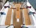 Six winches, traveller, backstay. That's all you need, and there's plenty of room for the crew