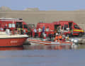 Fire brigade divers on the way to the search area