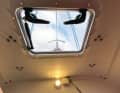 There are no inner shells or wooden panelling below deck. The laminate is only sealed with topcoat for weight reasons