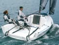 Tidy and uncluttered. You sit sideways on the deck, the cockpit offers plenty of space. The First has a twin rudder.