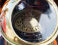 The compass with its diamond-shaped graduations sits in a brass housing