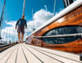 Where omission becomes a stylistic device: no railing, no chrome frames on the oval windows. Instead, a high foot rail and a wide running deck