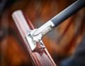 Modern boom on the mahogany tiller. A "keel-attached" rudder blade is moved, typical of the Classics on the 5.5s
