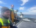 Co-Skipper Robert Stanjek, Skipper Ben Dutreux und ihre Crew kurz vor dem Einlaufen in Halifax