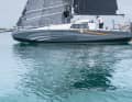 The chines in the waterline area only appear when the boat is in position. The large cabin windows make the superstructure appear clumsy