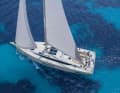 The cabin superstructure is pulled far forward. All halyards and sheets are now deflected aft towards the helmsman