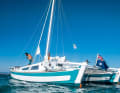 Tiki 30: Banana hulls with hats, a small deckhouse, no boom and attached oars
