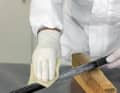 Rough sanding is required to allow the resin to adhere. Work ten centimetres beyond the damage on both sides