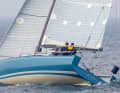 The striking aft chine is striking. Despite the width and the flat bulkhead aft, the design manages with just one rudder blade