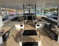 Large guest cockpit under the optional carbon bimini - and in the centre the companionway to the crew quarters
