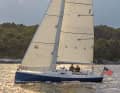 Attractive and simple. The slender hull with little freeboard and a vertical stem is pleasing to the eye