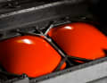 The helmet shell is moulded in the next production step. The blank with the colour is placed in another machine