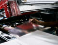 The production process starts with a film blank. This is placed in a press by hand