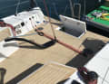 Division of labour. The tiller, which ends far forward, positions the rudder well away from the traveller and backstay